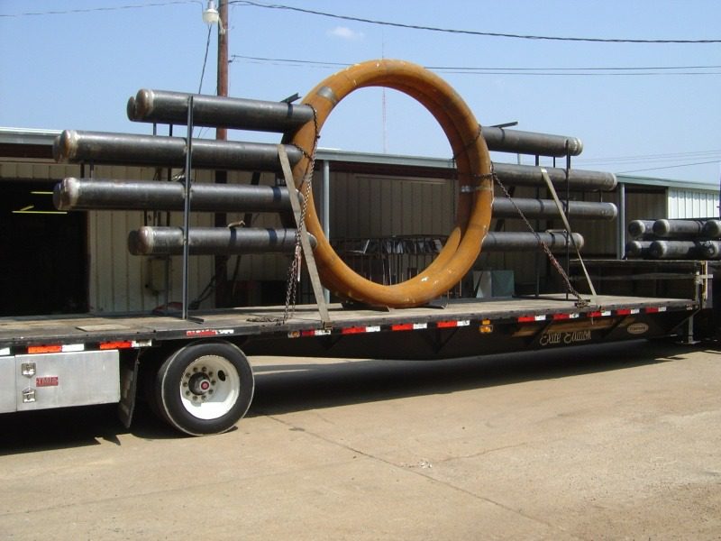 A large metal object on the back of a trailer.