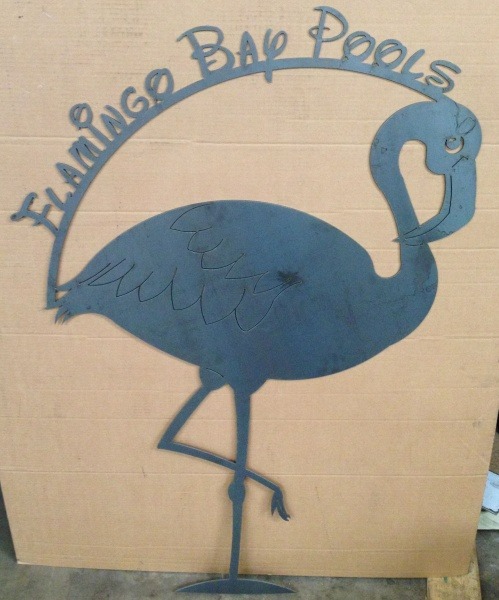 A sign with a flamingo on it